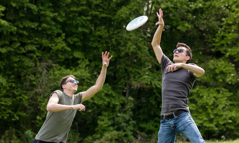 2 men playing frisbee