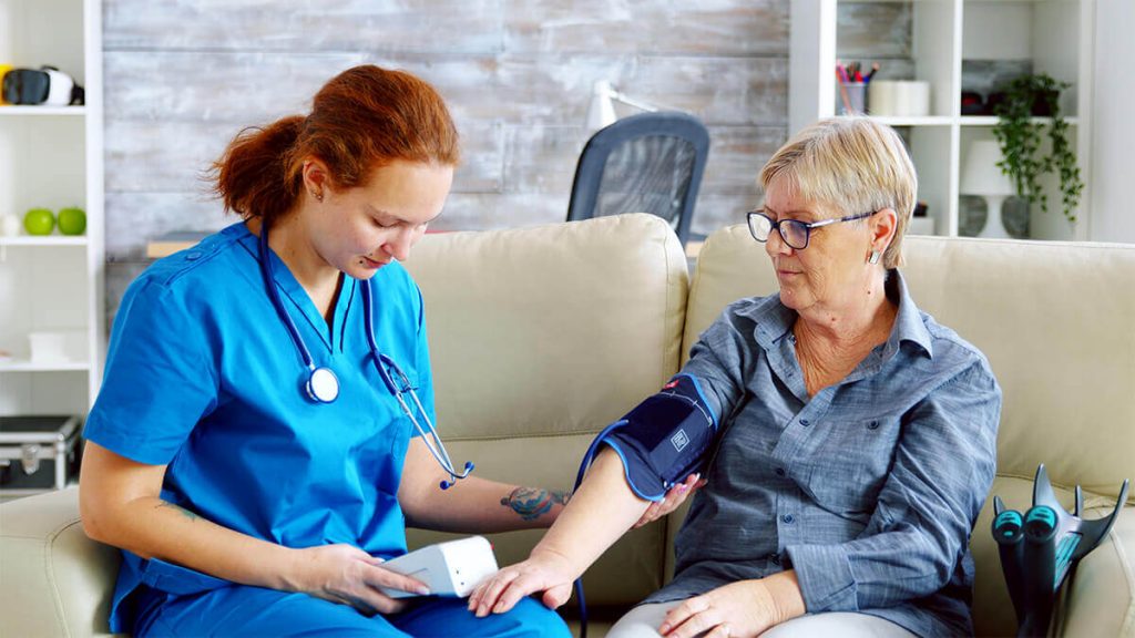 nurse checking old patient